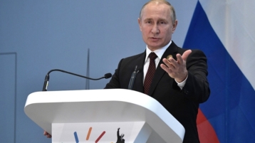 Poetin: "De VS moet dollar niet als politiek wapen gebruiken"